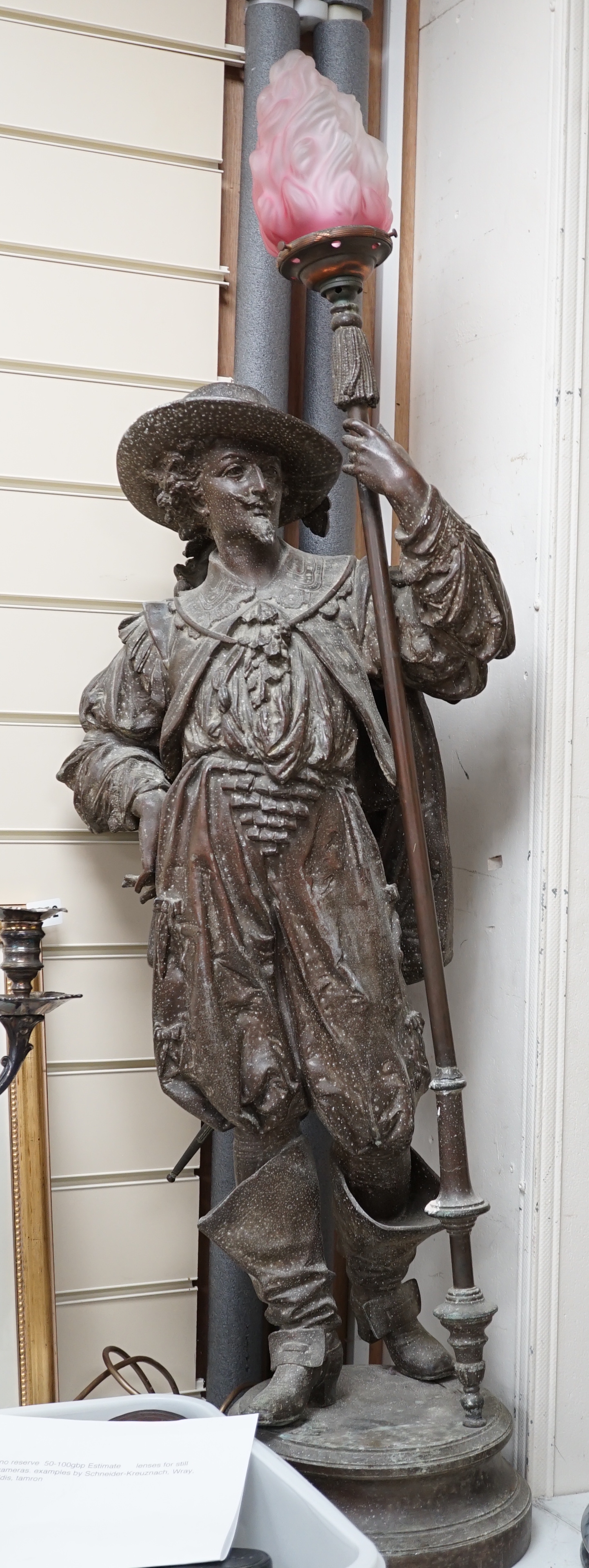A 20th century spelter figural Cavalier floor lamp, with glass torch shade, approximately 108cm high